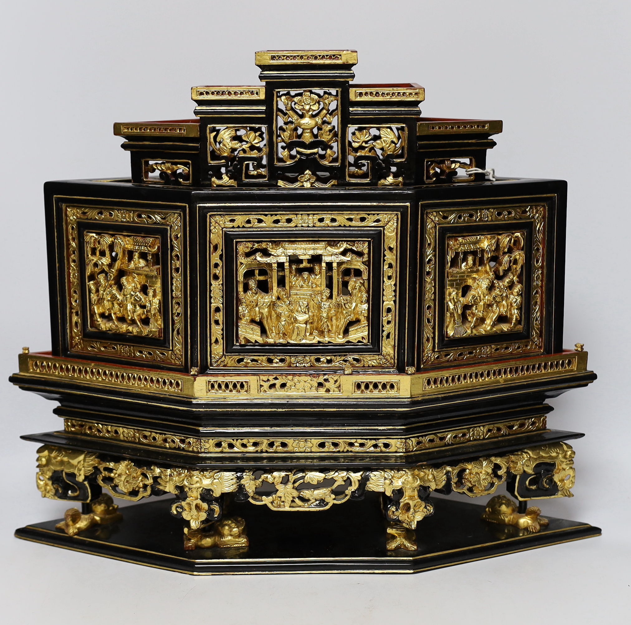 A 20th century Chinese carved lacquered wood altar stand, 49cm wide